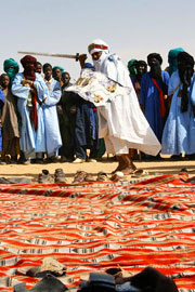 Tuareg man dancing in ceremony with sword (click to enlarge)